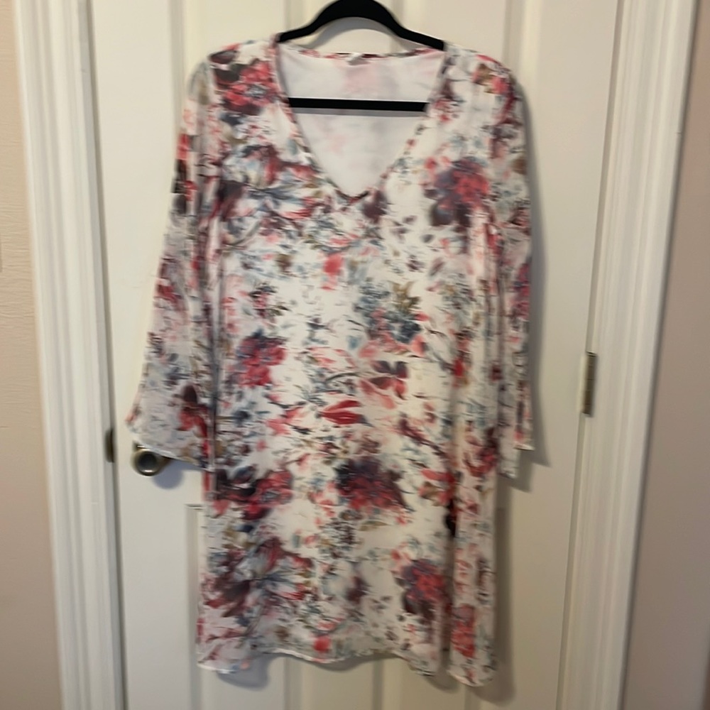 Pink Blush (brand)  dress  - V neck with Attached lining and long sleeves.